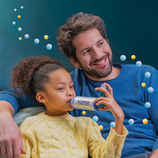 Father sitting with daughter using VORTEX® Non-Electrostatic holding spacer for MDI Treatment