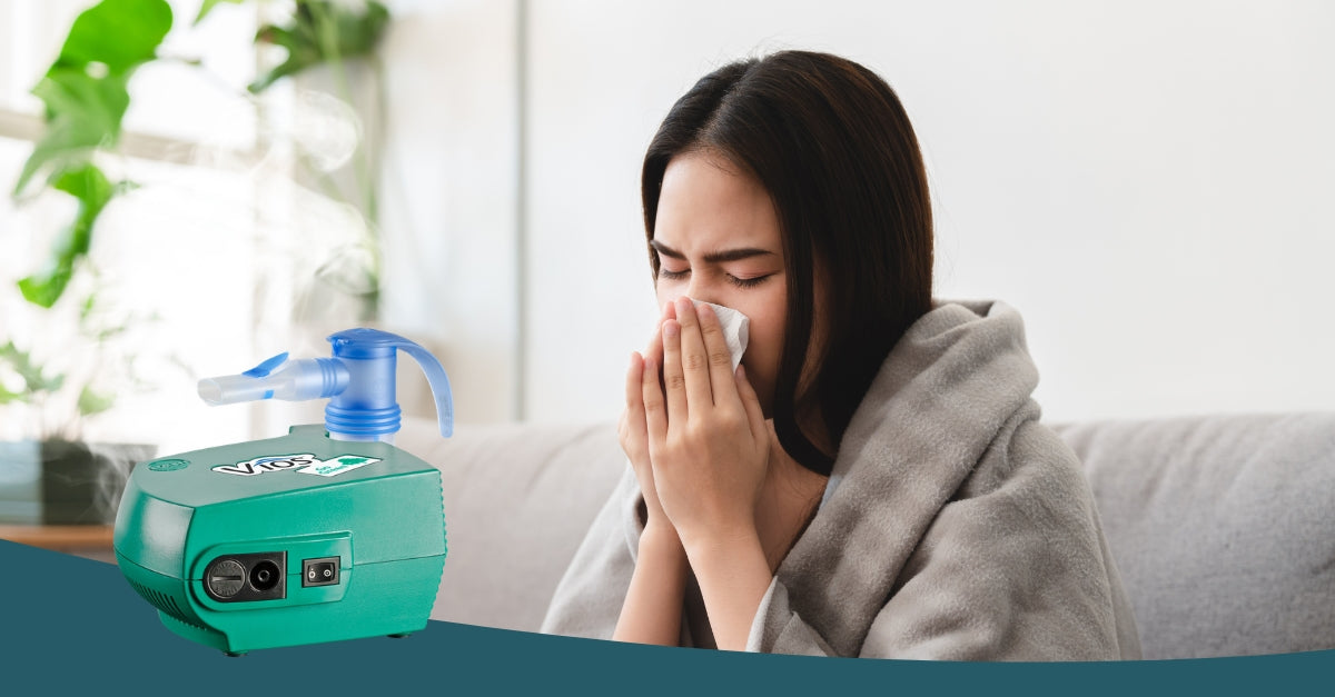 Woman blowing her nose into a tissue with PARI Vios Go Green Nebulizer