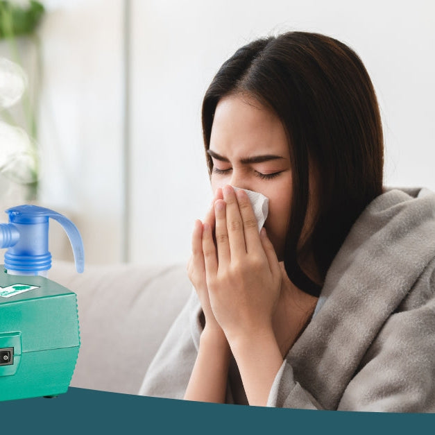 Woman blowing her nose into a tissue with PARI Vios Go Green Nebulizer