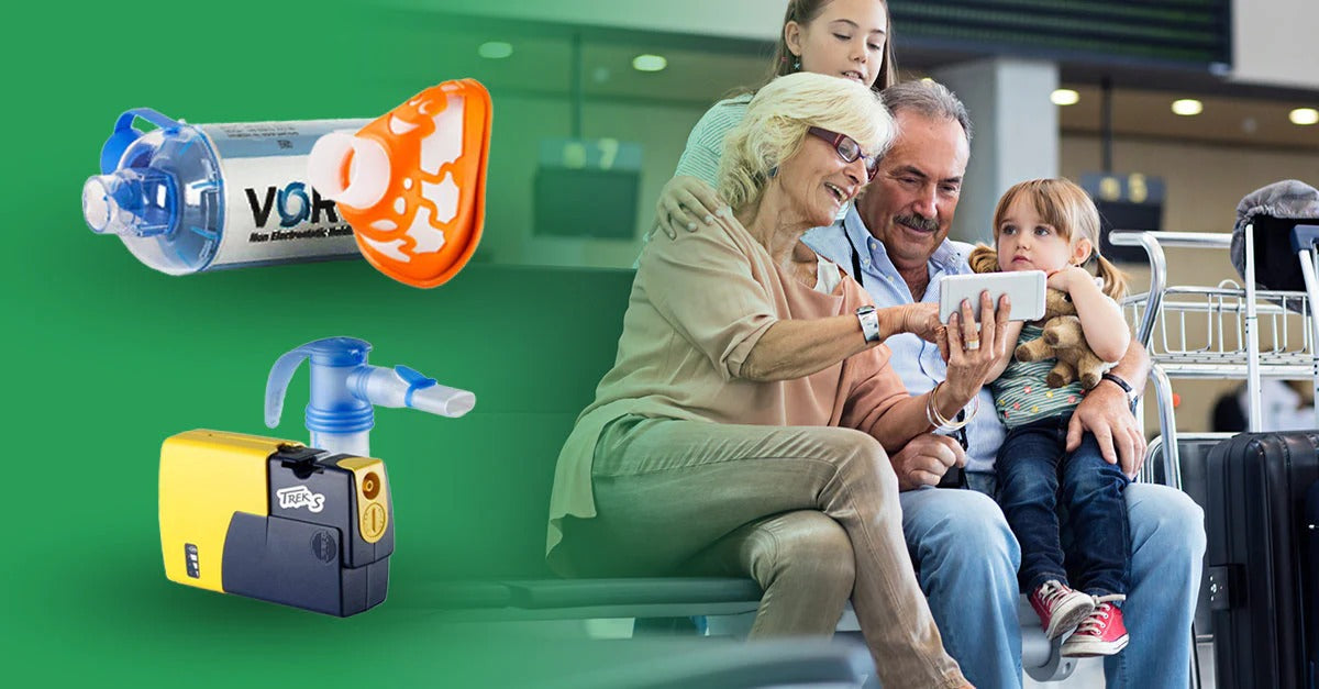 Family traveling at an airport looking at a phone with their nebulizer systems